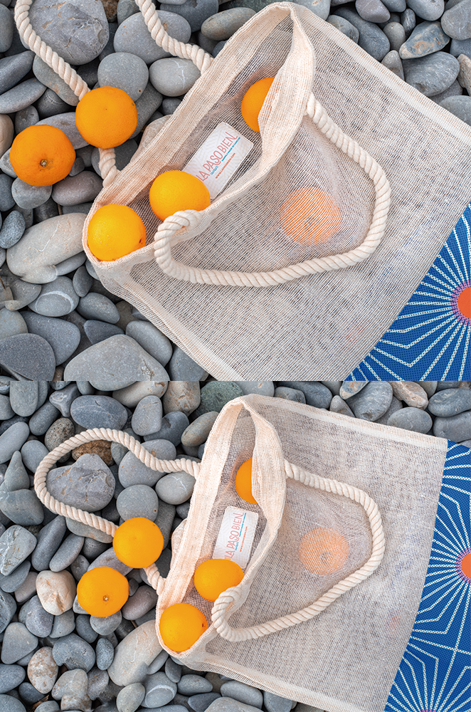 Close up of our jute tote bag with mandarines inside